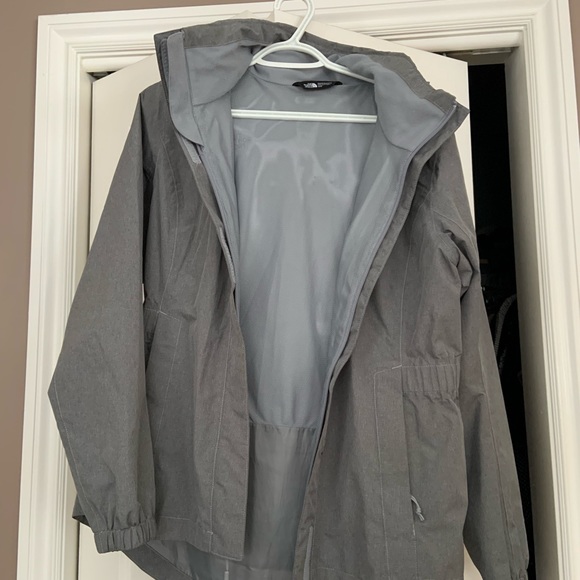 Barely used, grey North Face rain jacket. Hood folds in. - Picture 4 of 4